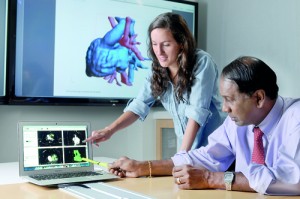 In his lab: Ajit and a team member study the performance of heart valves and how these valves are affected by disease