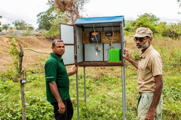 Prithviraj Fernando (right) at solar panel fence box (Smriti Daniel)
